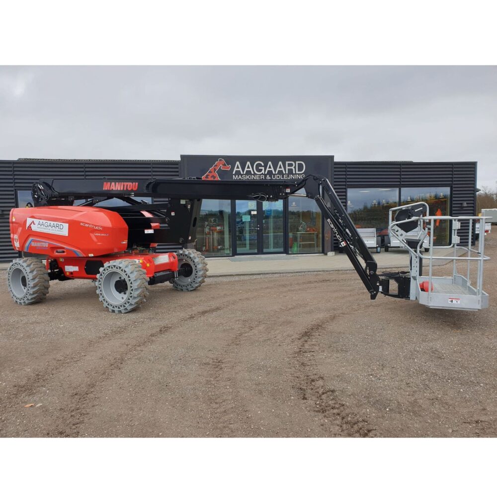 a red machine in front of a building