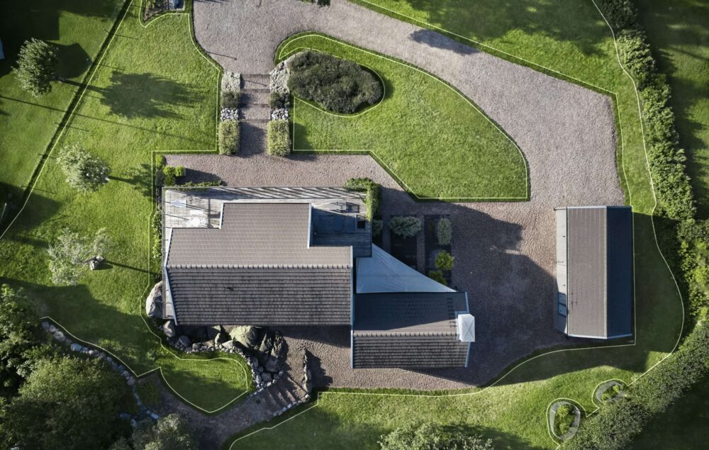 a house with a driveway and grass