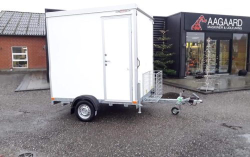 a white trailer with a door