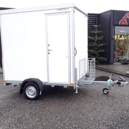 a white trailer with a door