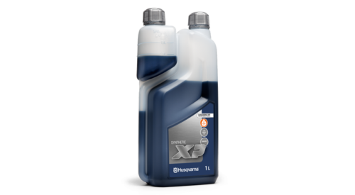 En flaske Husqvarna syntetisk olie.