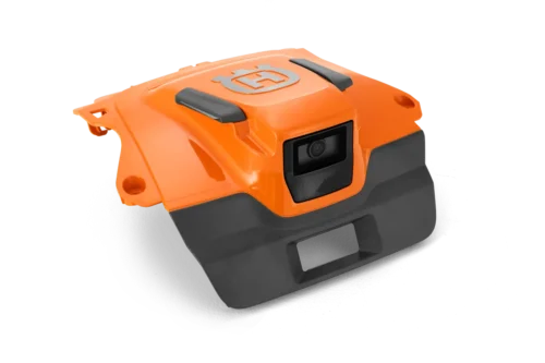 Kamera på en orange Husqvarna robotklipper.