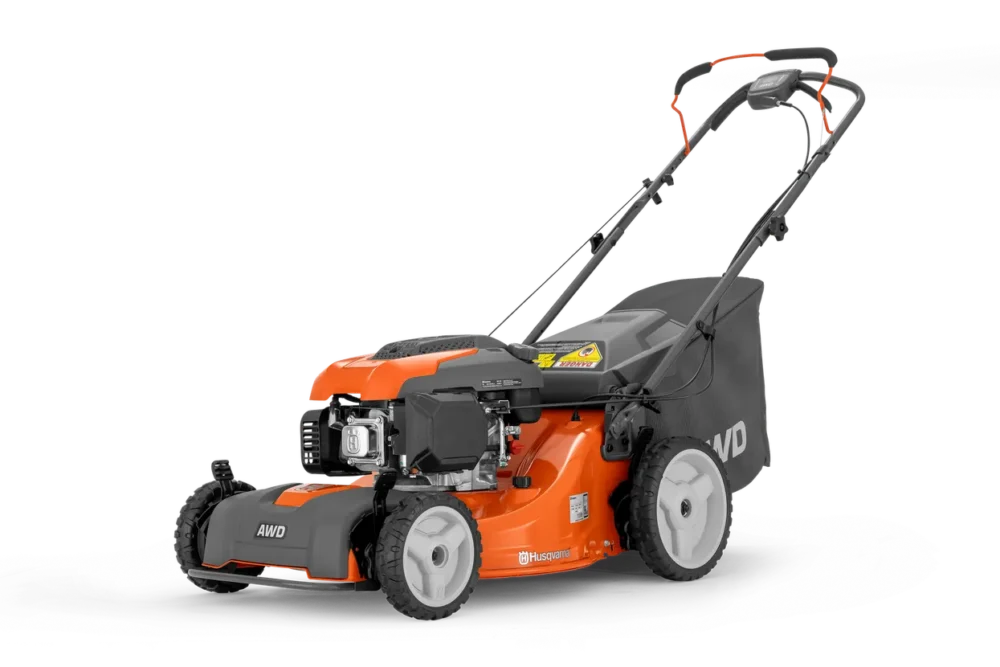 Orange og sort Husqvarna plæneklipper.